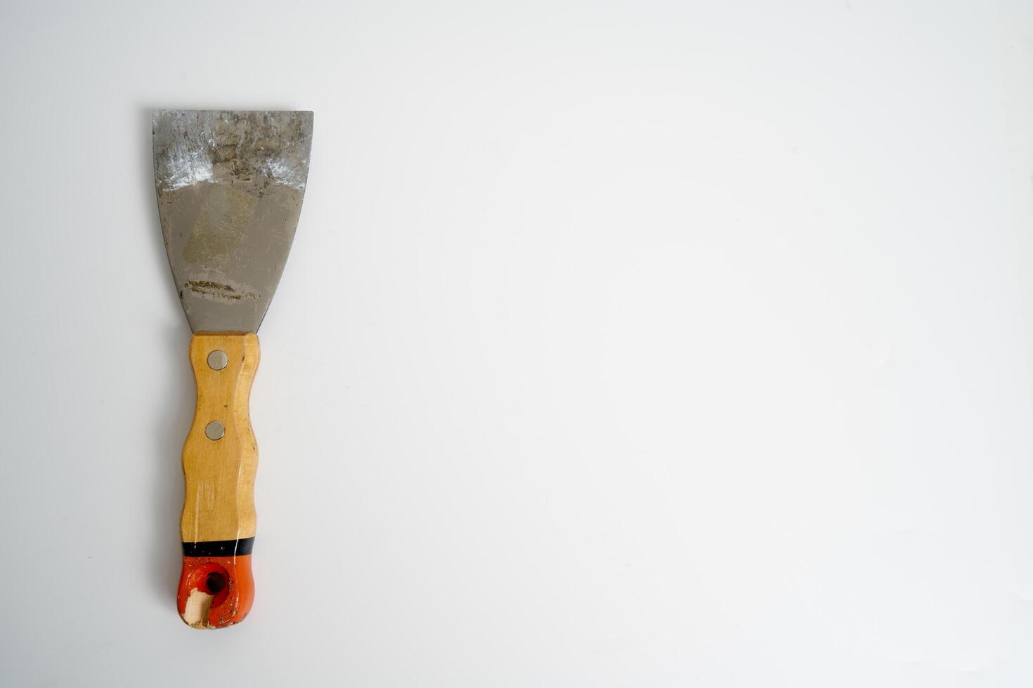 construction spatula with wooden handle photo