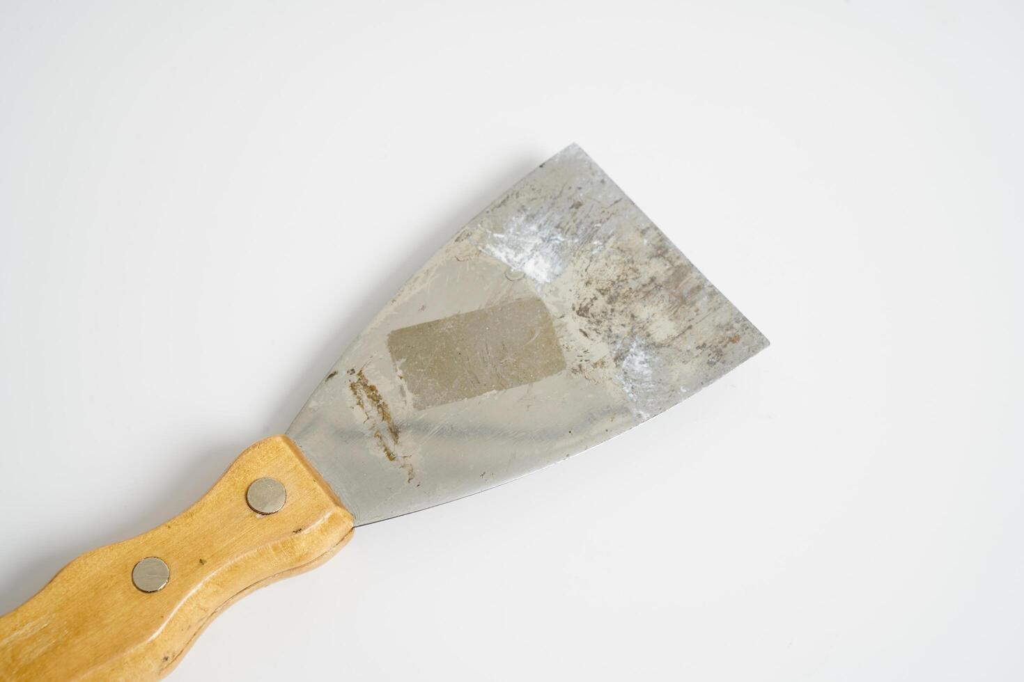 construction spatula with wooden handle photo