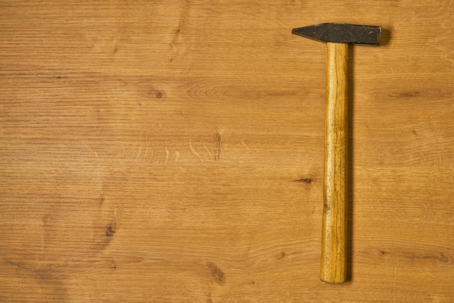 carpenters hammer on a table photo