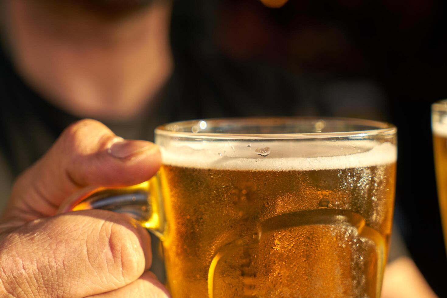 male hands holding beer photo