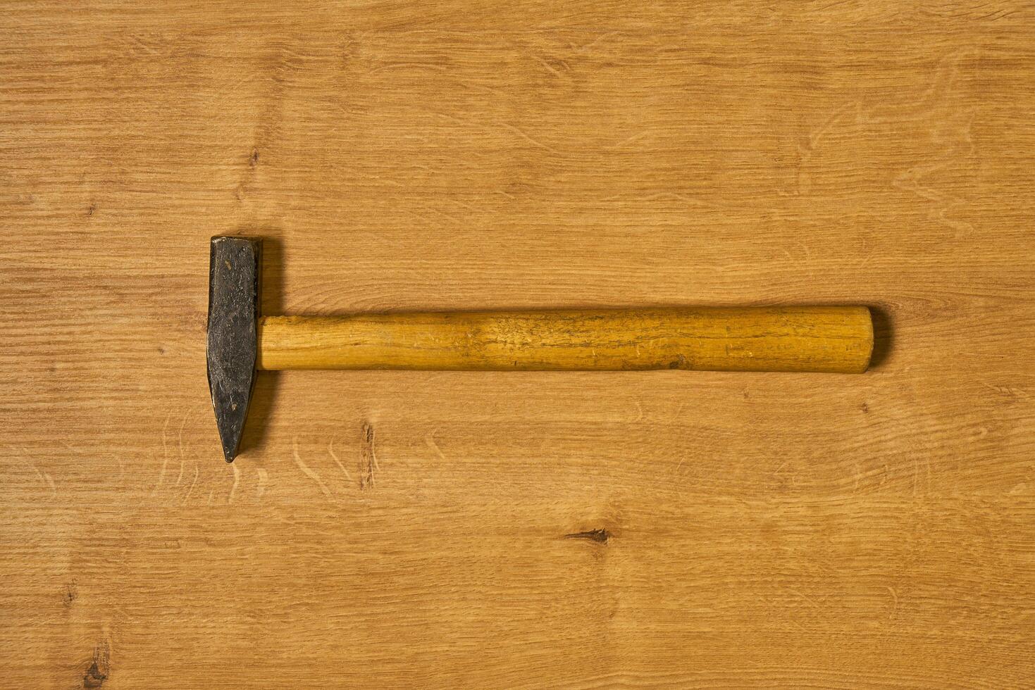 carpenters hammer on a table photo