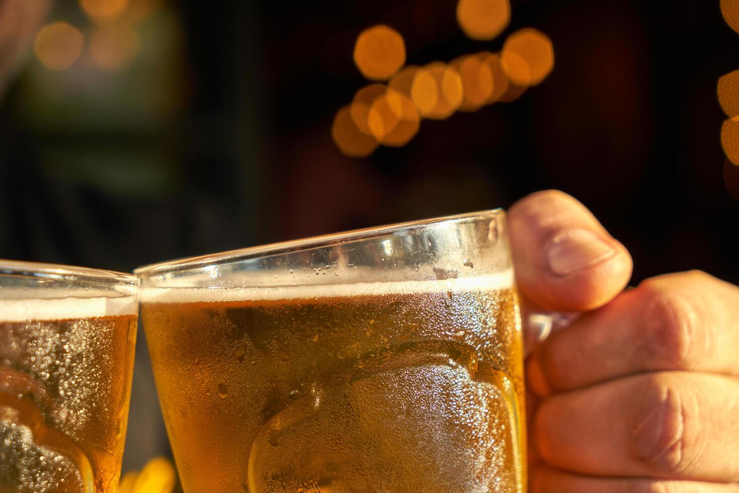male hands holding beer photo
