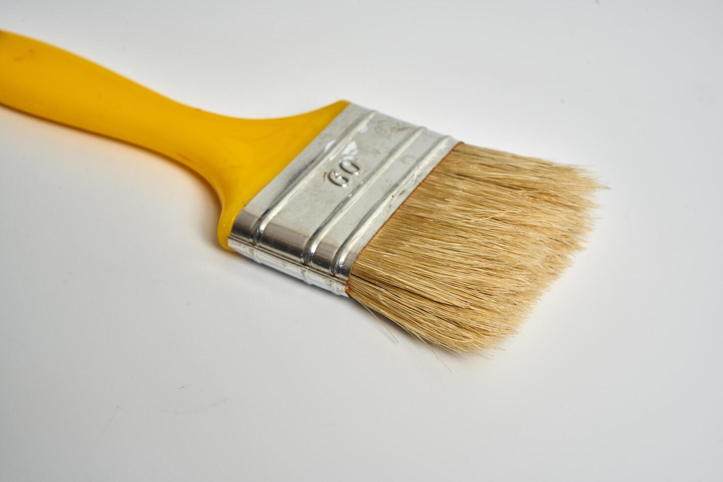small paint brush on a white background photo