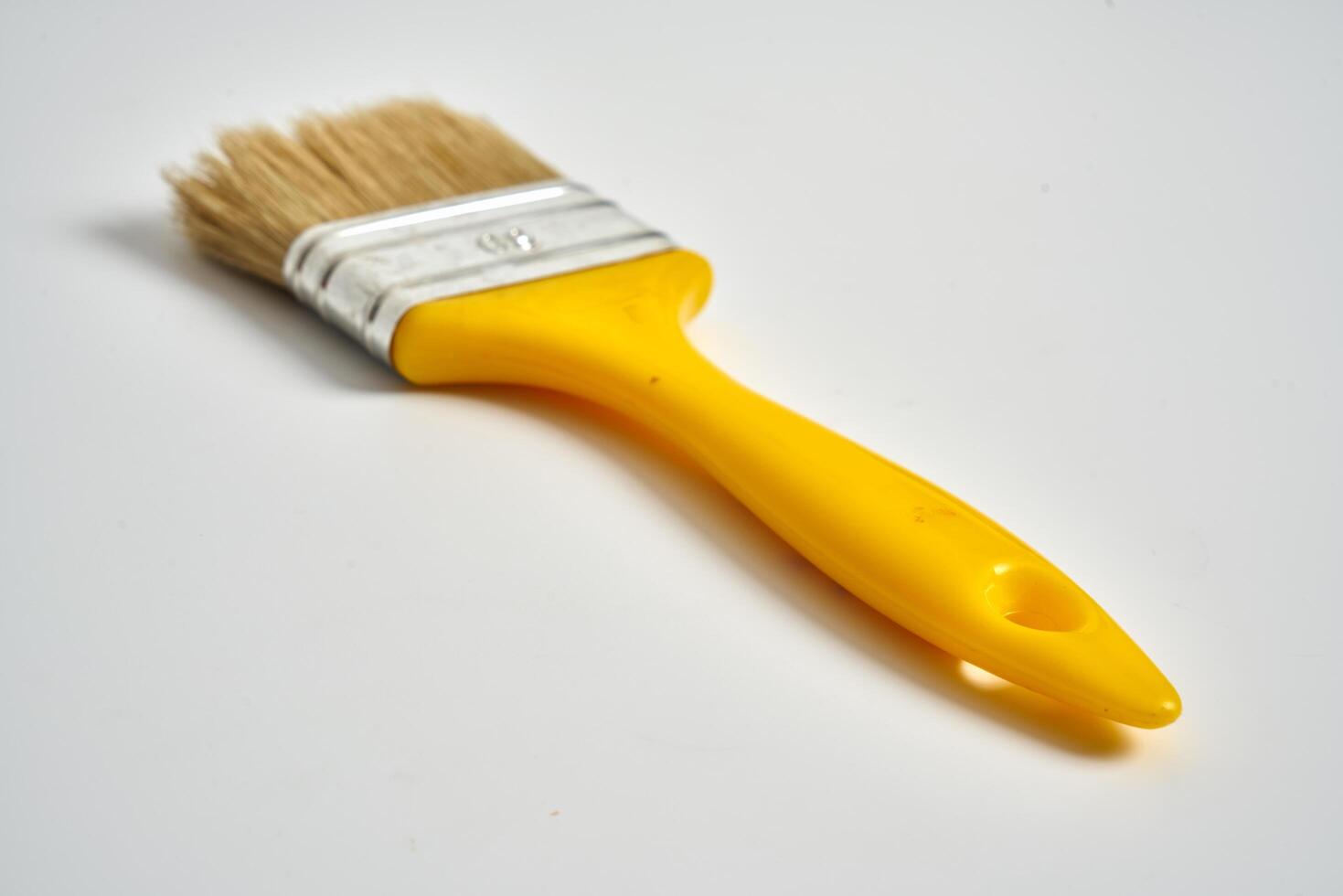 small paint brush on a white background photo