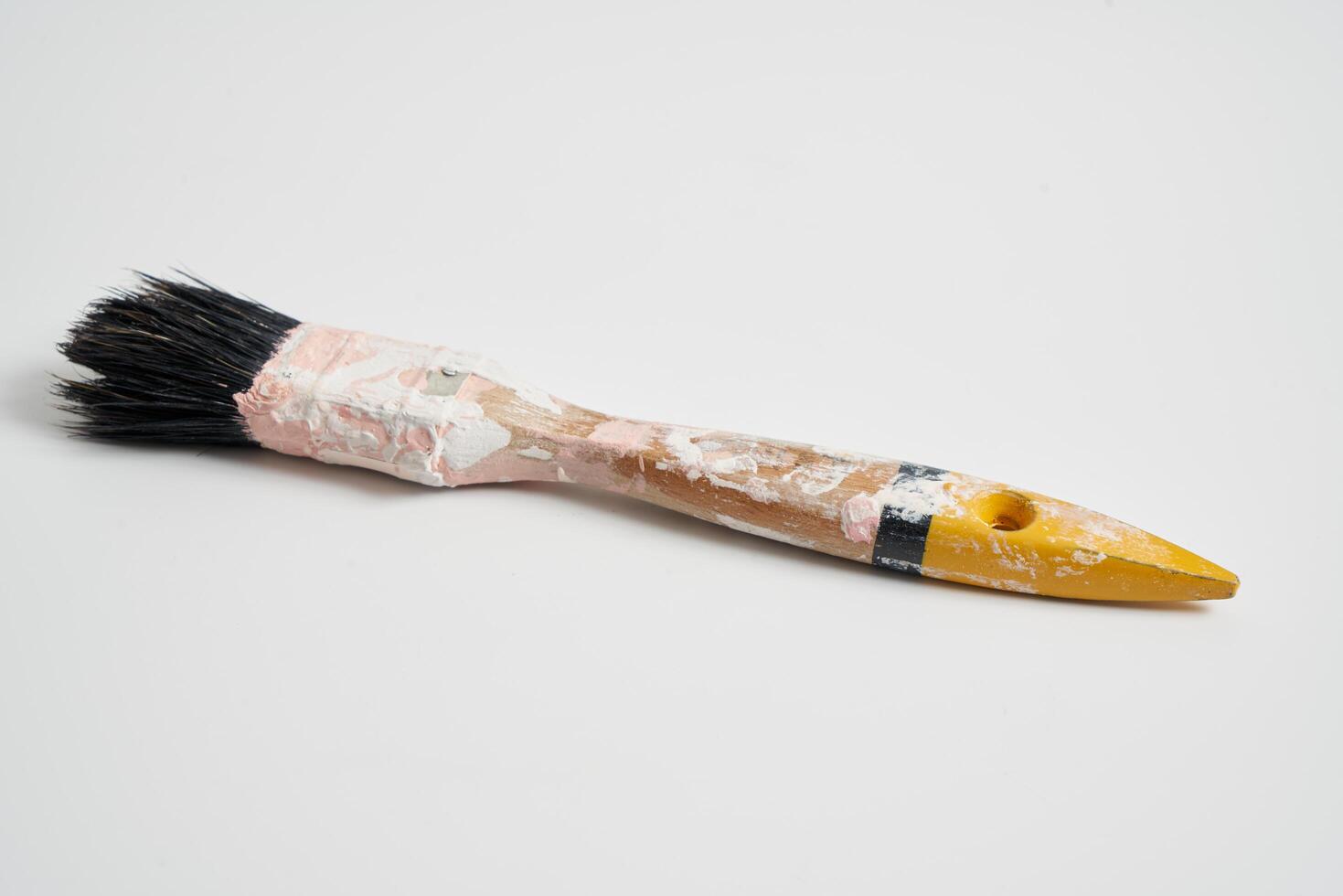 small paint brush on a white background photo