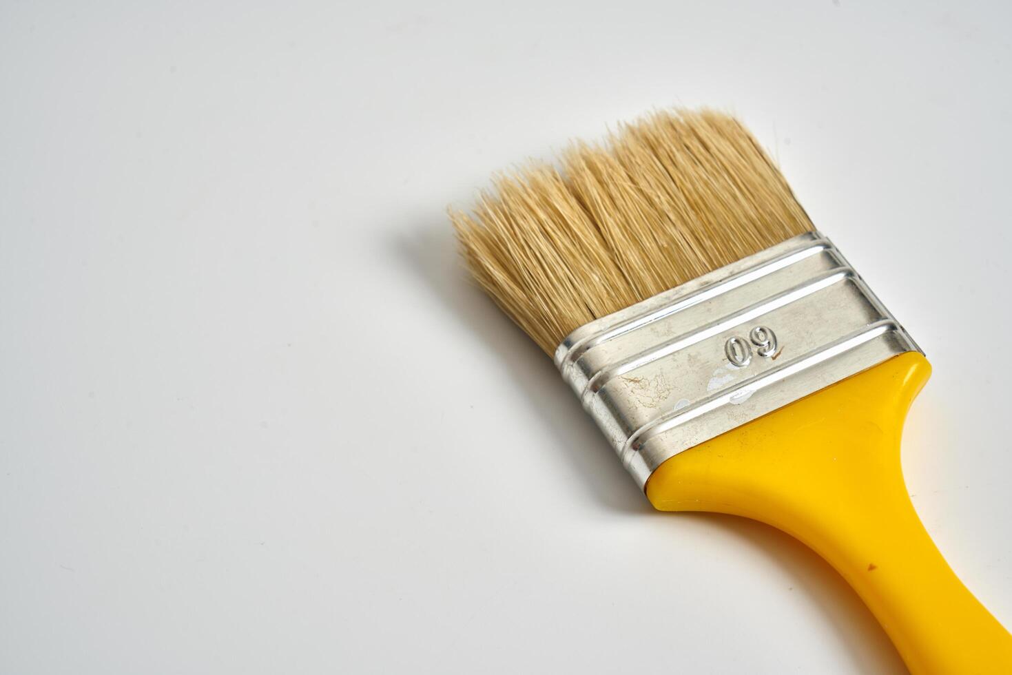 small paint brush on a white background photo