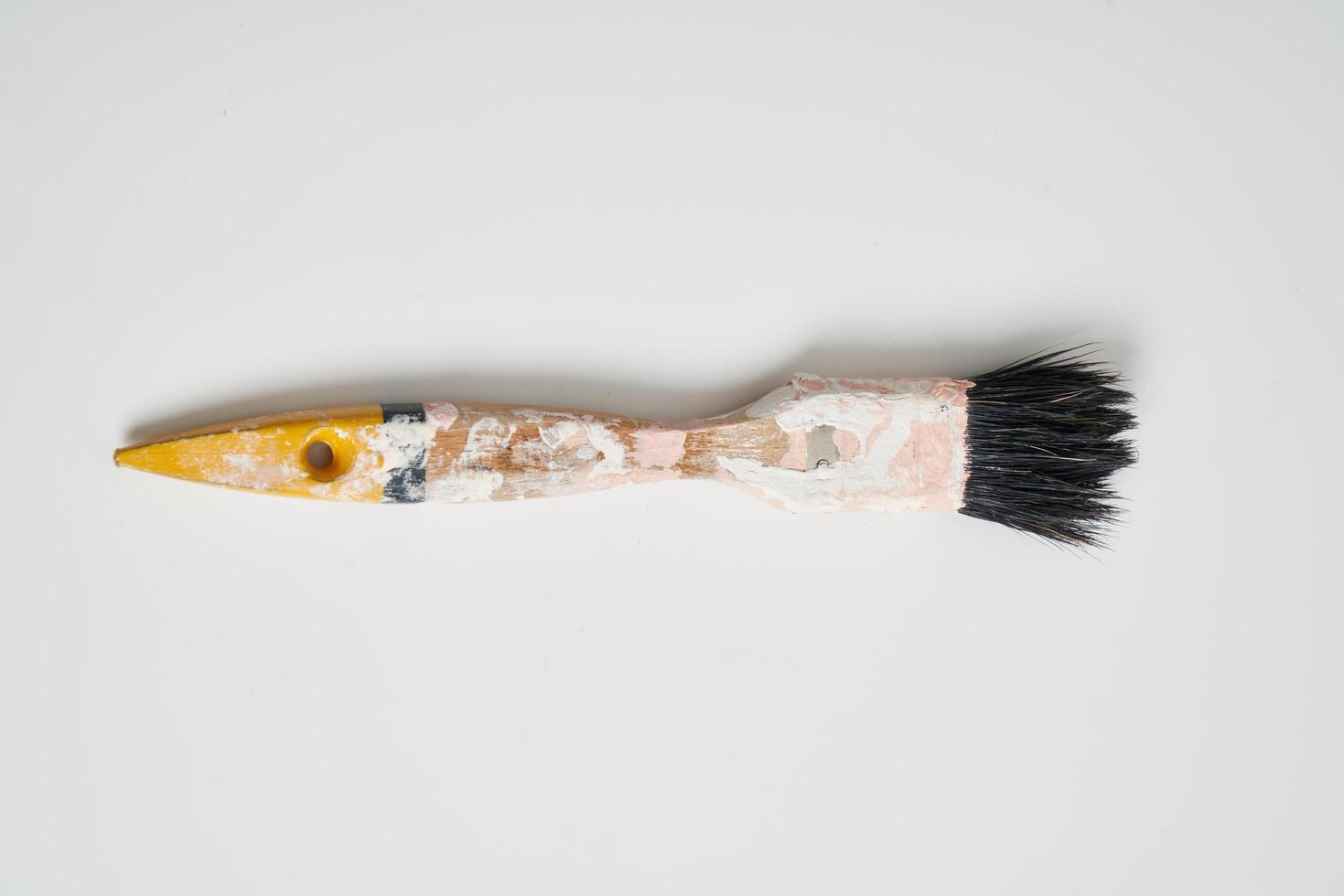 small paint brush on a white background photo