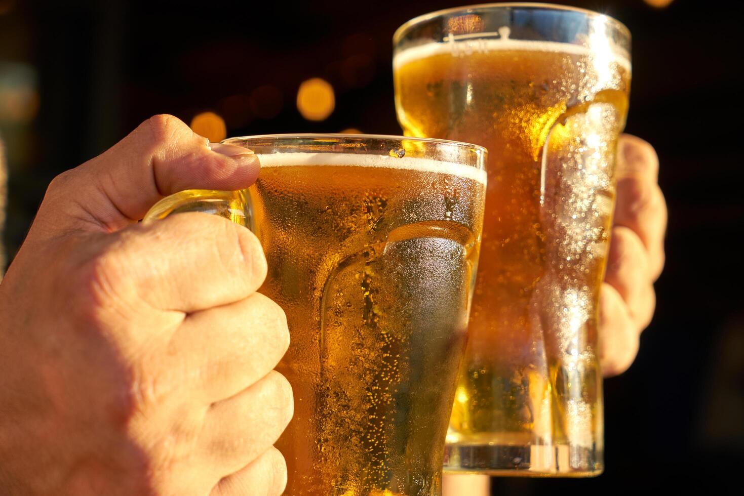 male hands holding beer photo
