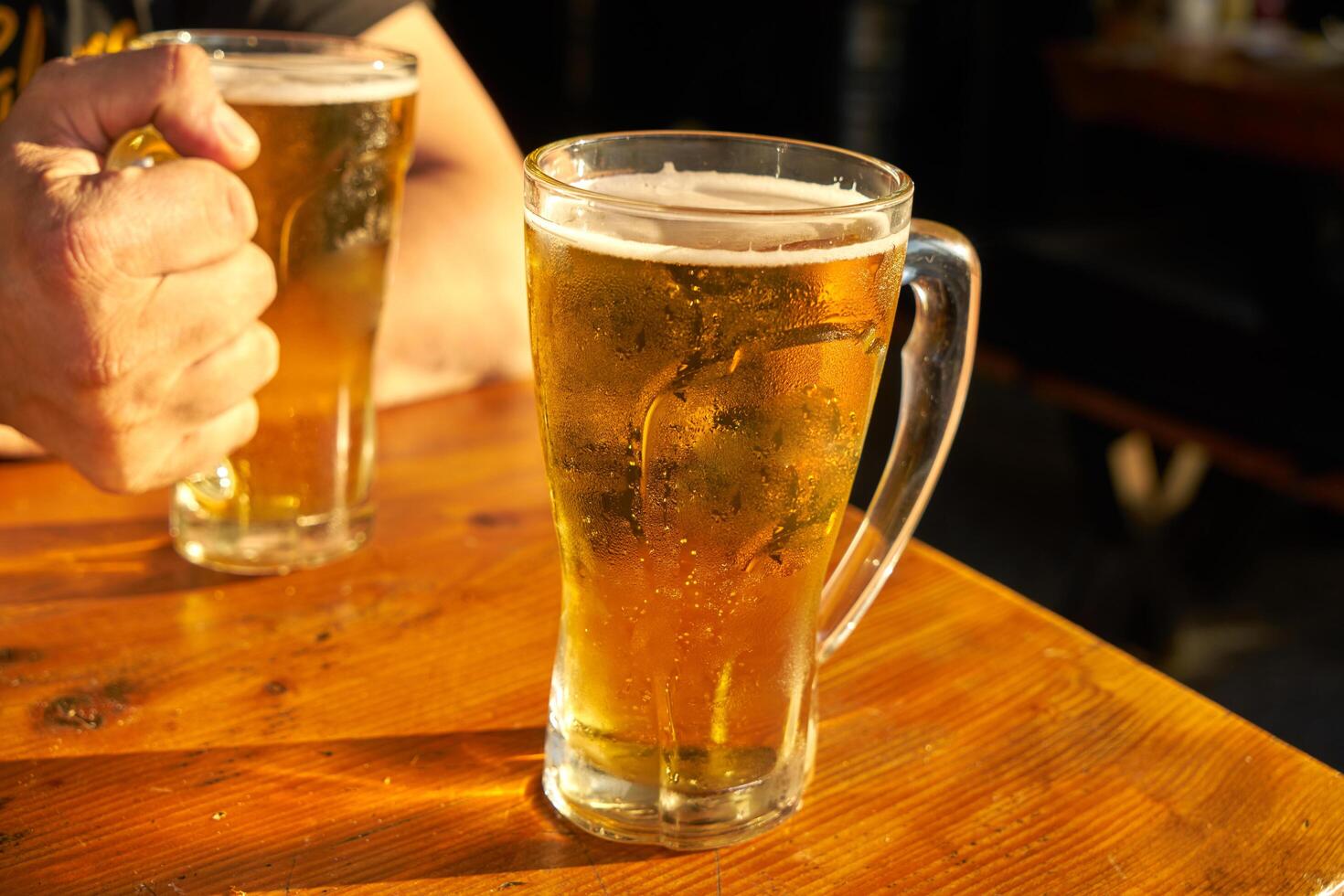male hands holding beer photo