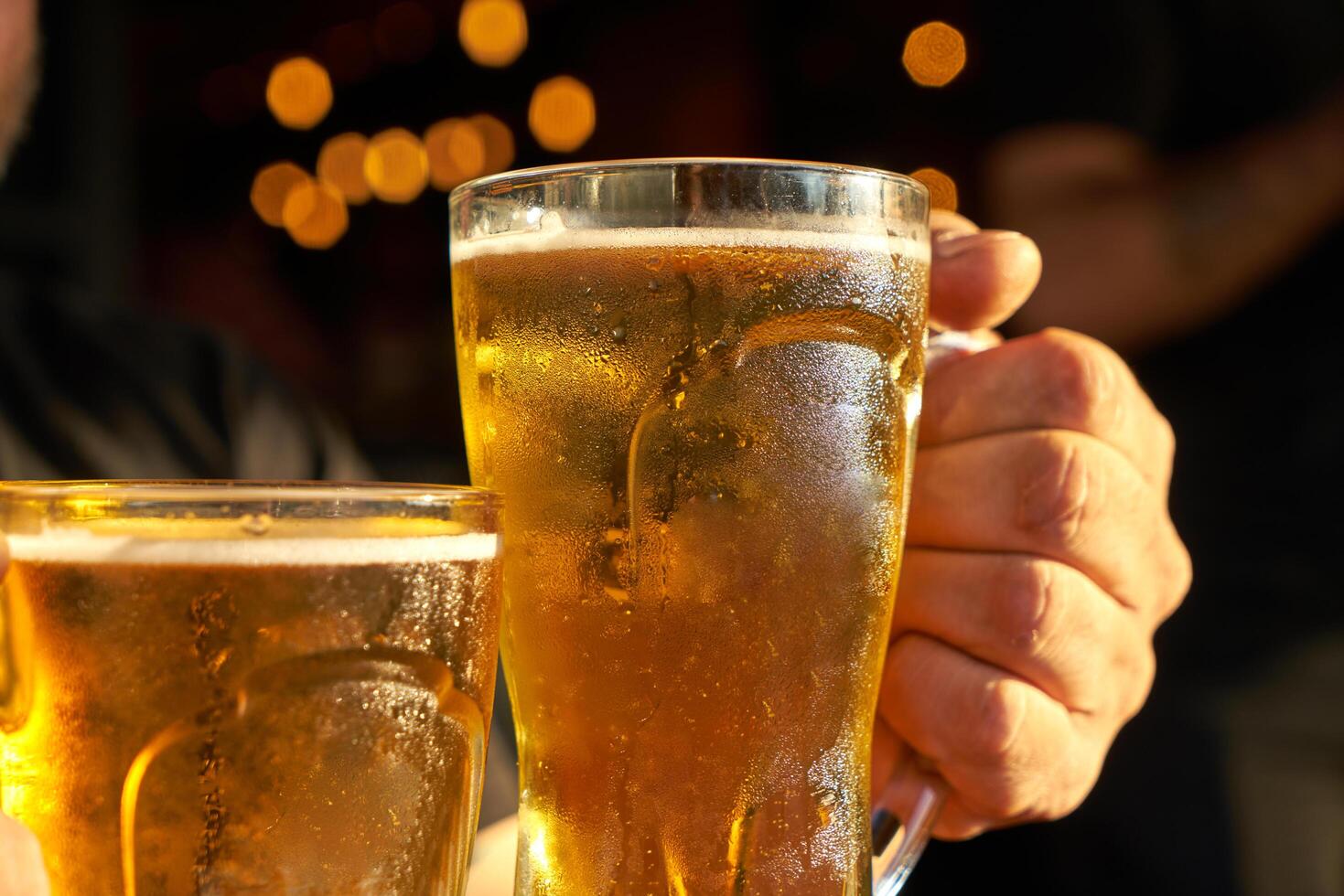 male hands holding beer photo