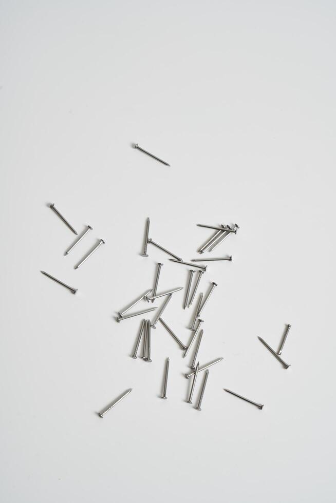 Wood nails on a white background photo