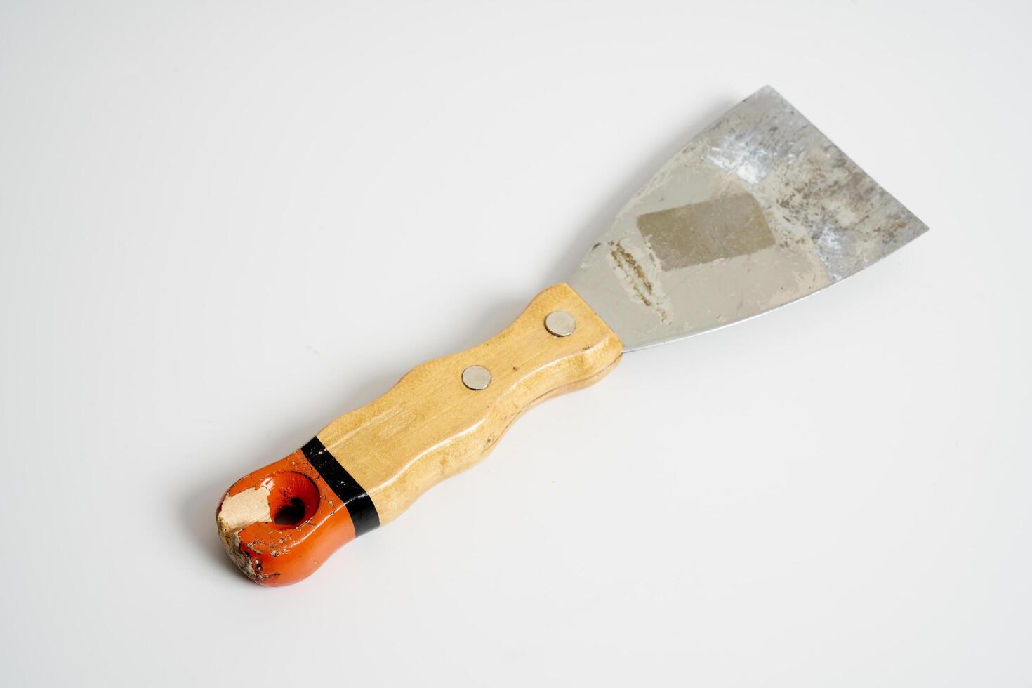 construction spatula with wooden handle photo