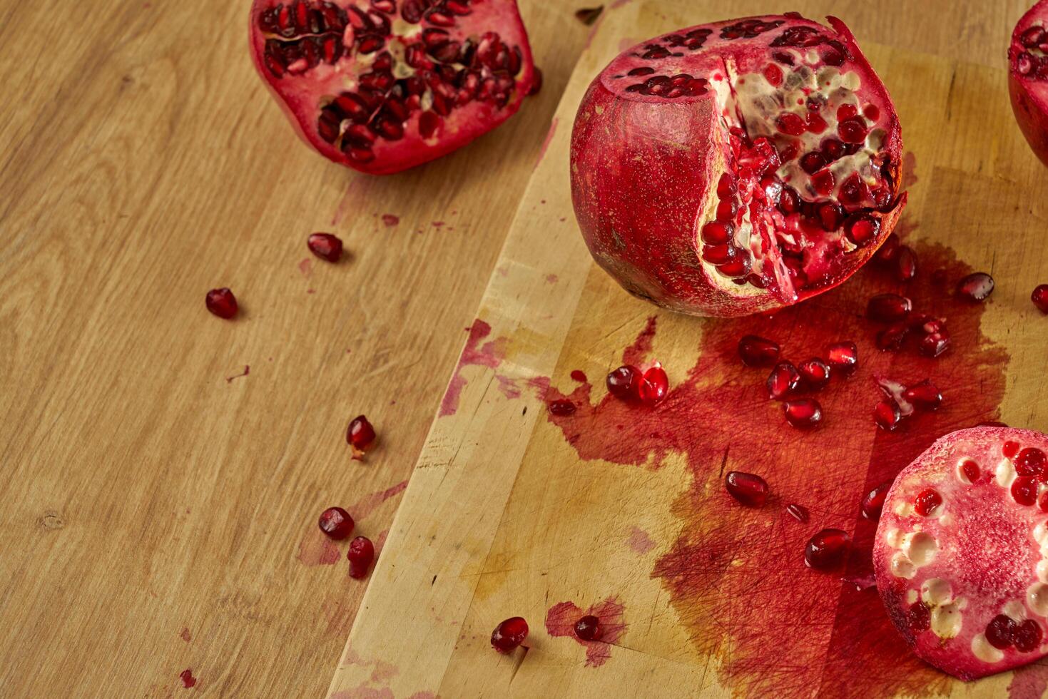 pomegranate on a cutting board photo