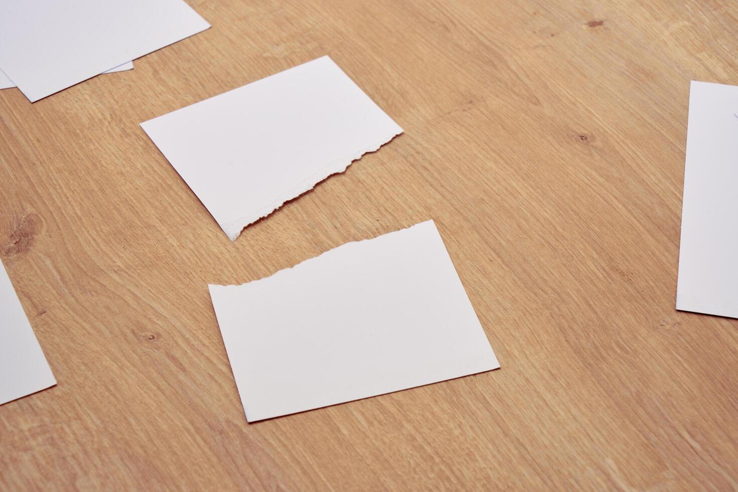 a 4 paper and pen on a table photo