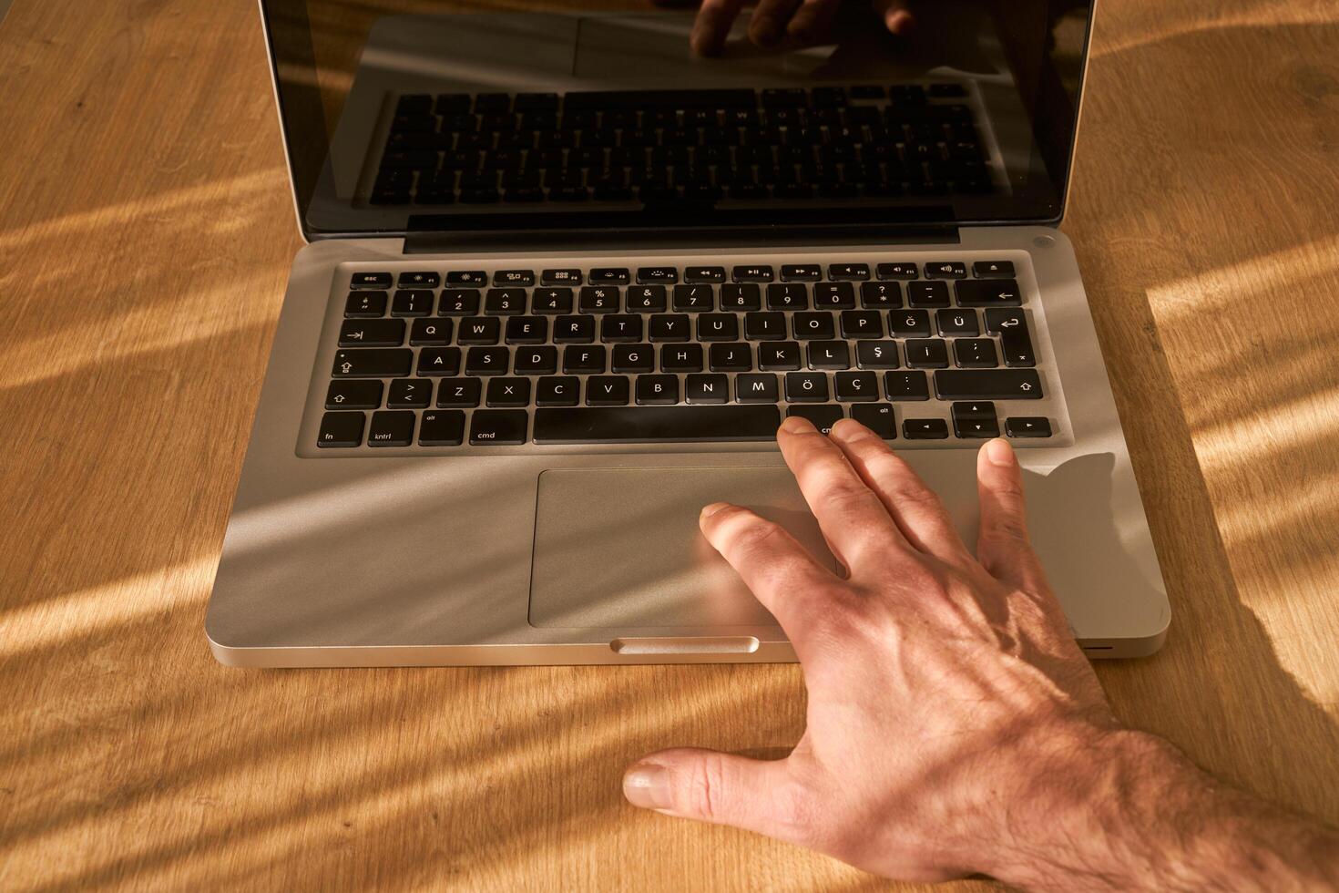 metallic grey laptop on a table photo