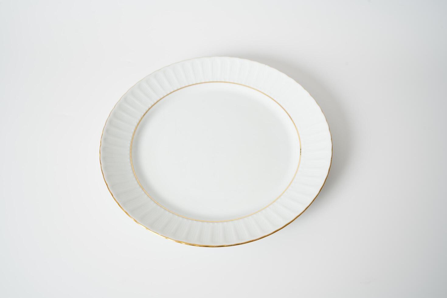 white ceramic plate on a white background photo