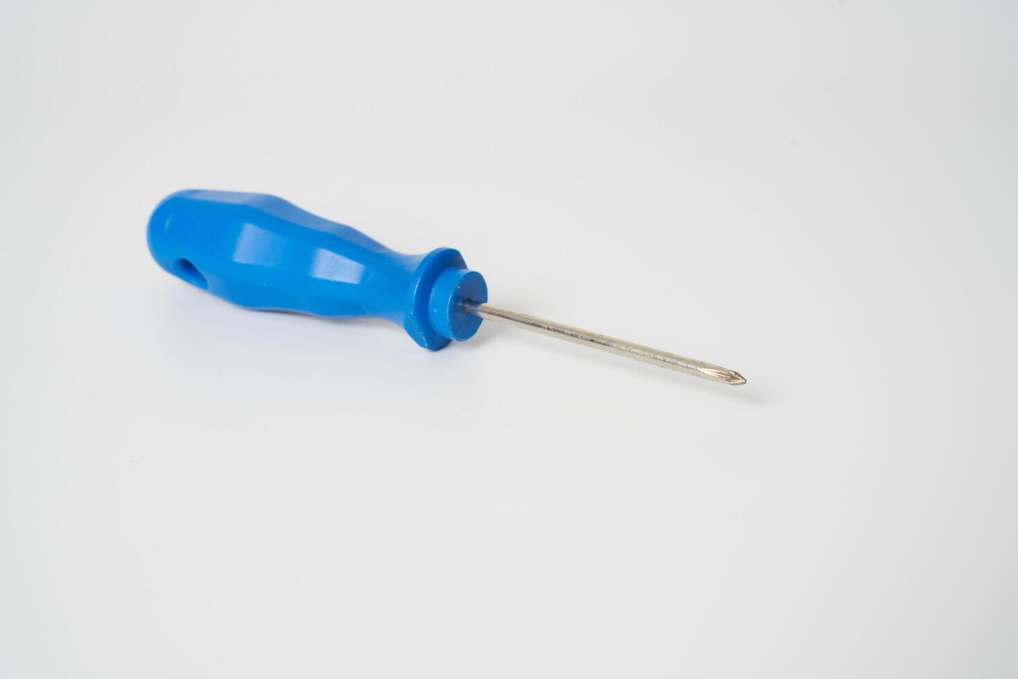 Blue screw driver on white background photo