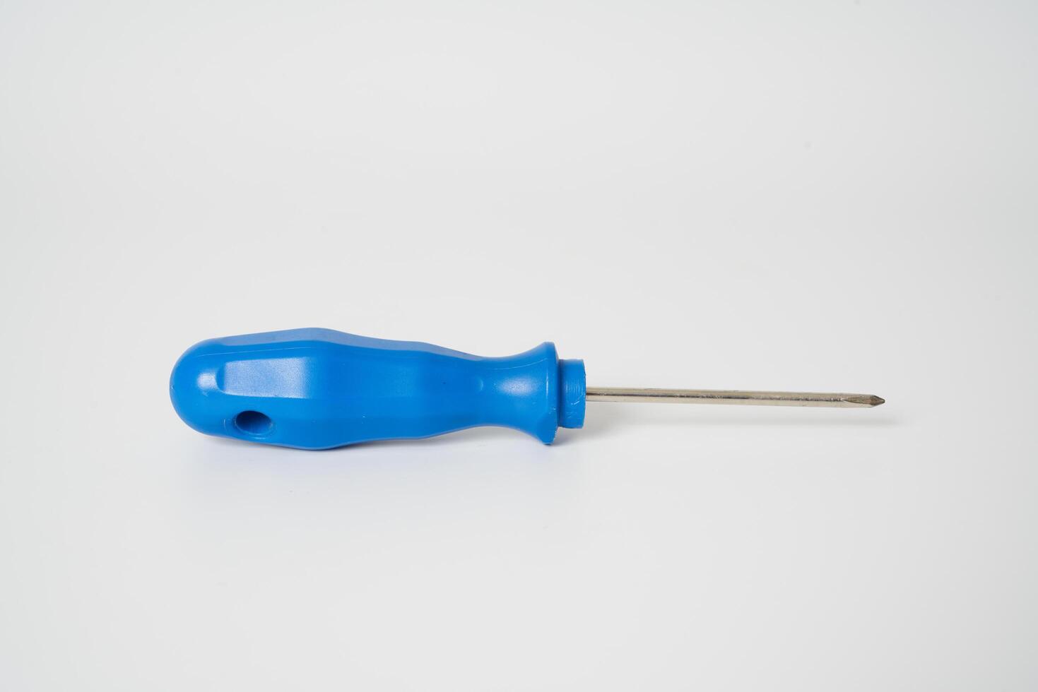 Blue screw driver on white background photo