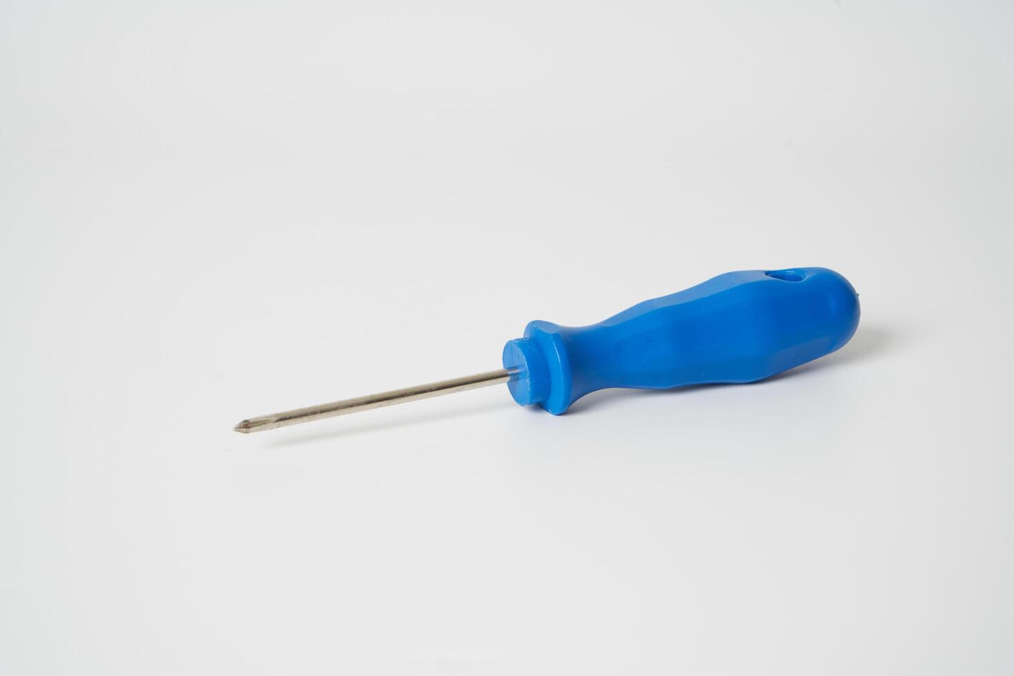 Blue screw driver on white background photo