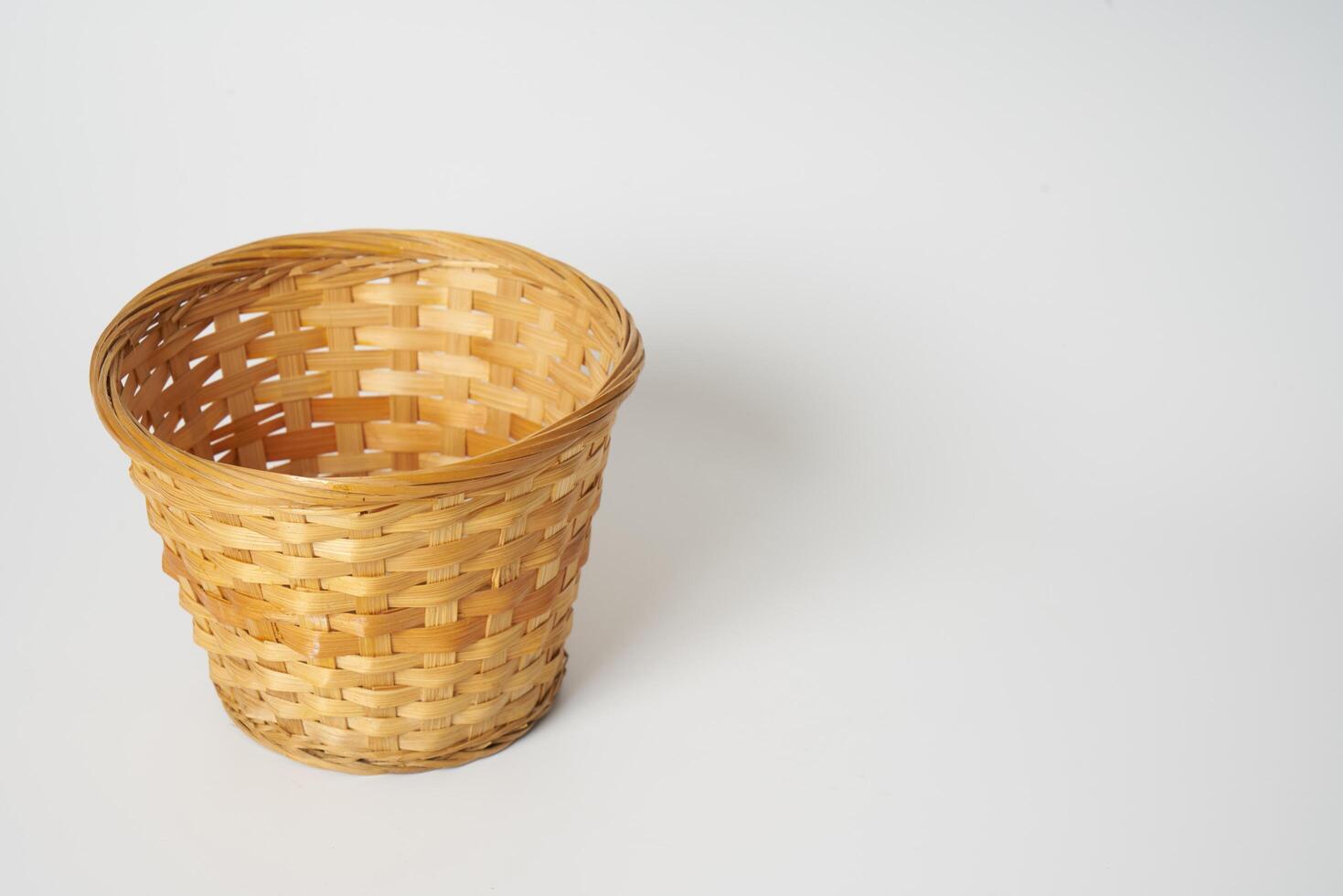 Wicker basket on white photo