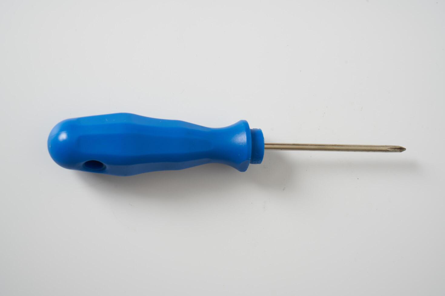 Blue screw driver on white background photo