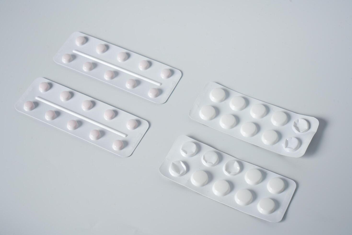 Painkillers on white background photo
