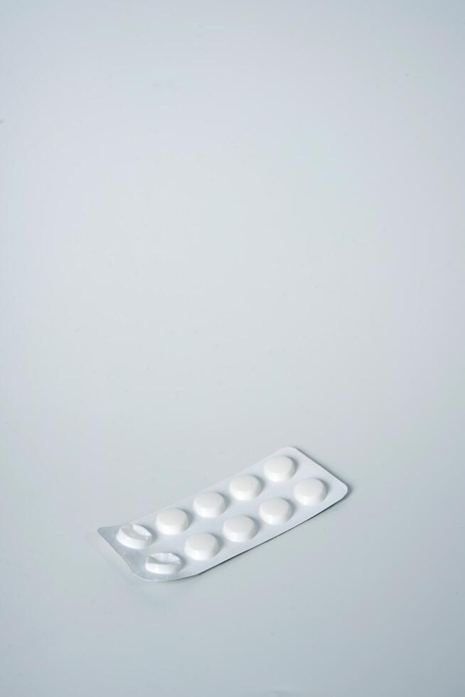 Painkillers on white background photo