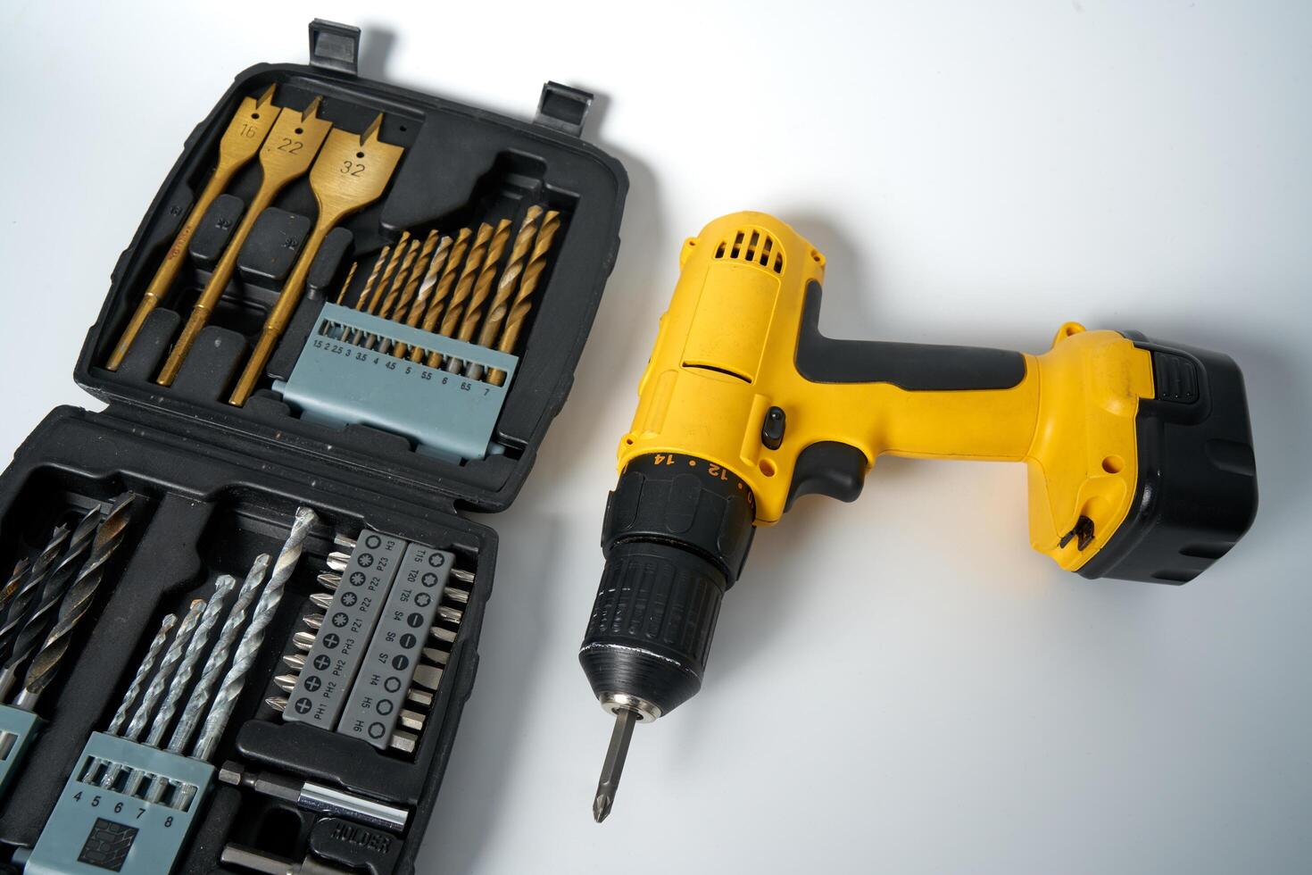 Yellow and black cordless drill. photo