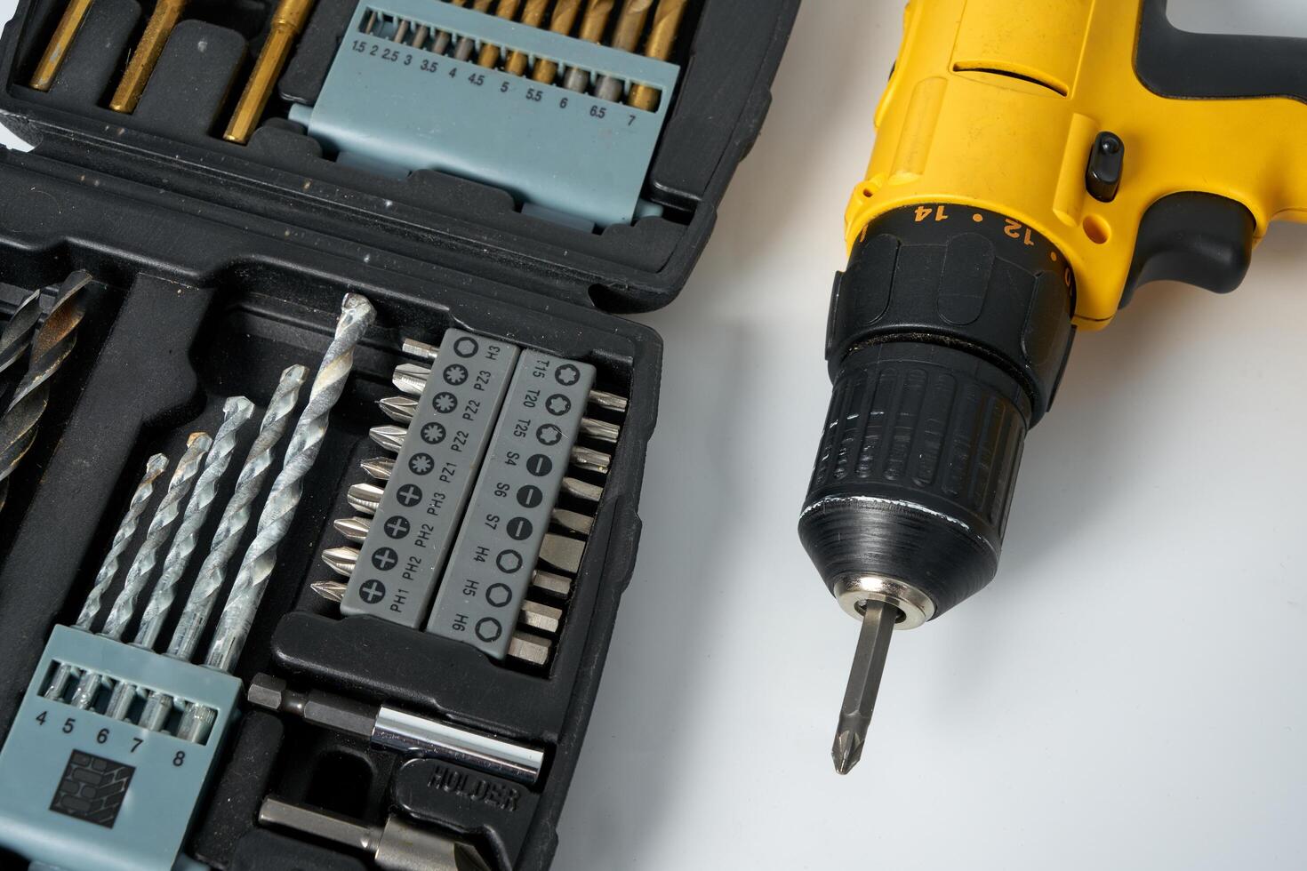 Yellow and black cordless drill. photo