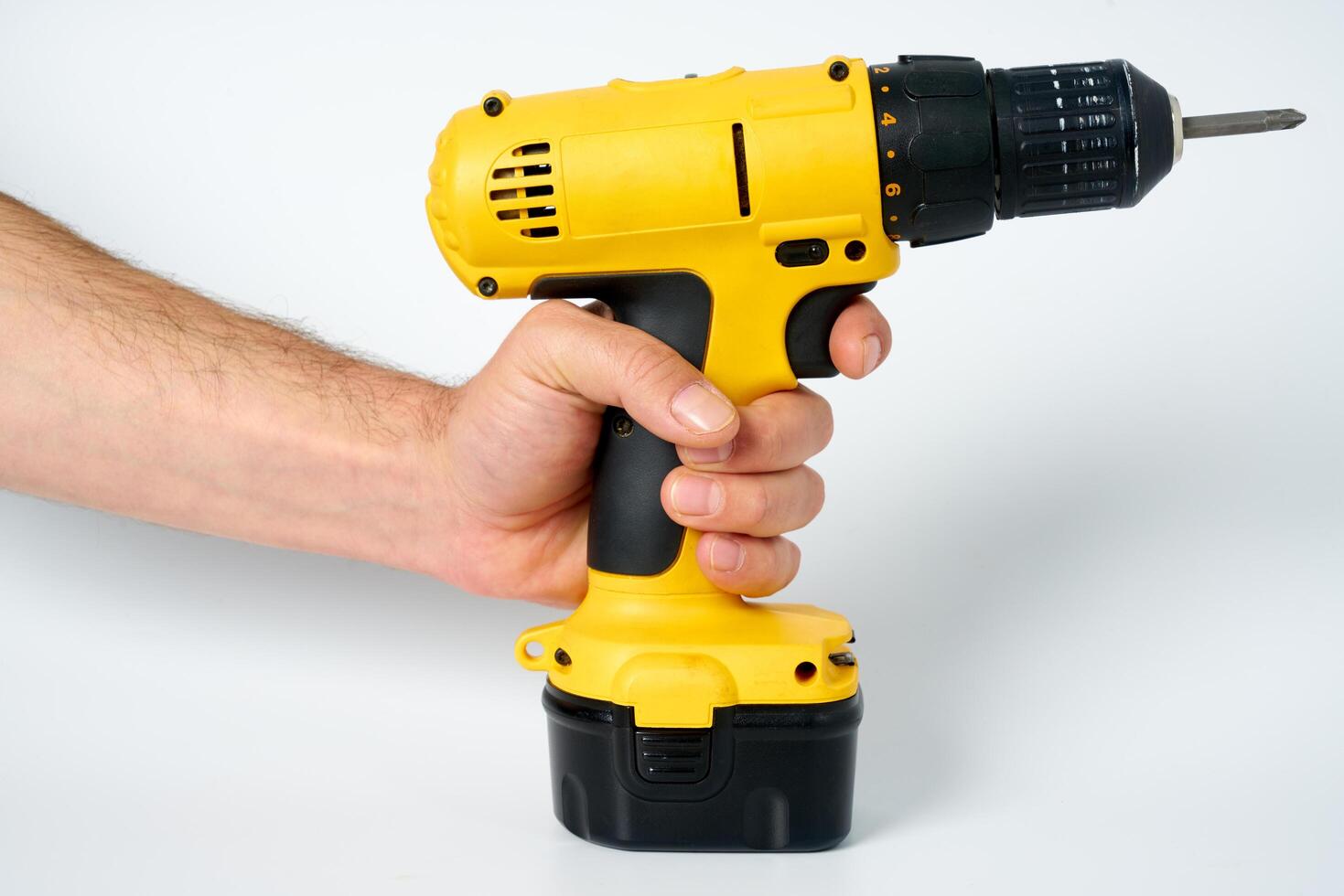 Yellow and black cordless drill. photo