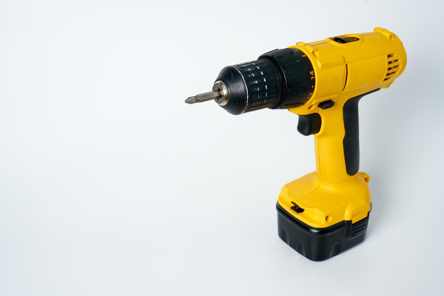 Yellow and black cordless drill. photo