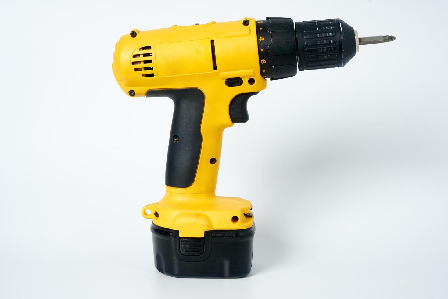 Yellow and black cordless drill. photo