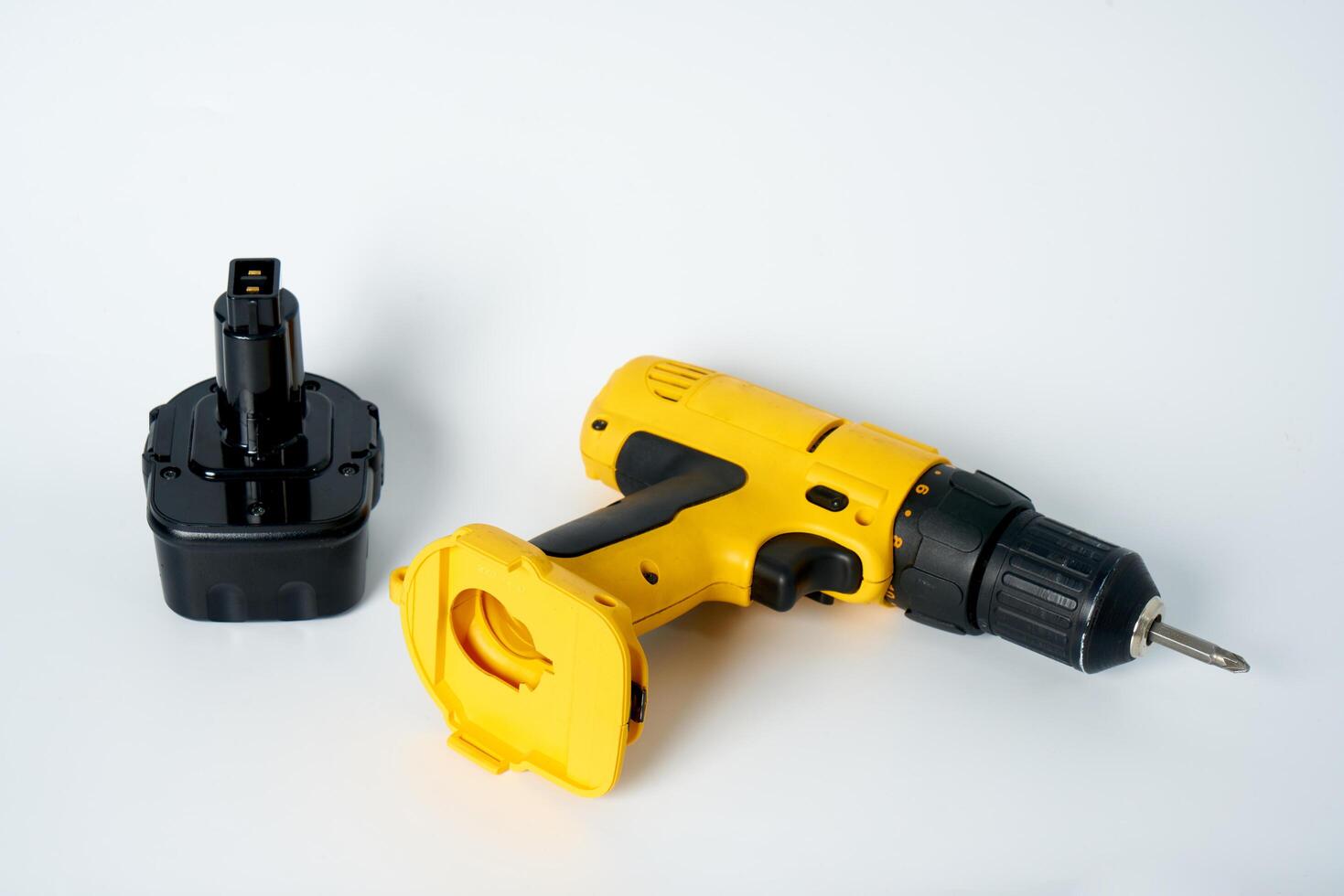 Yellow and black cordless drill. photo