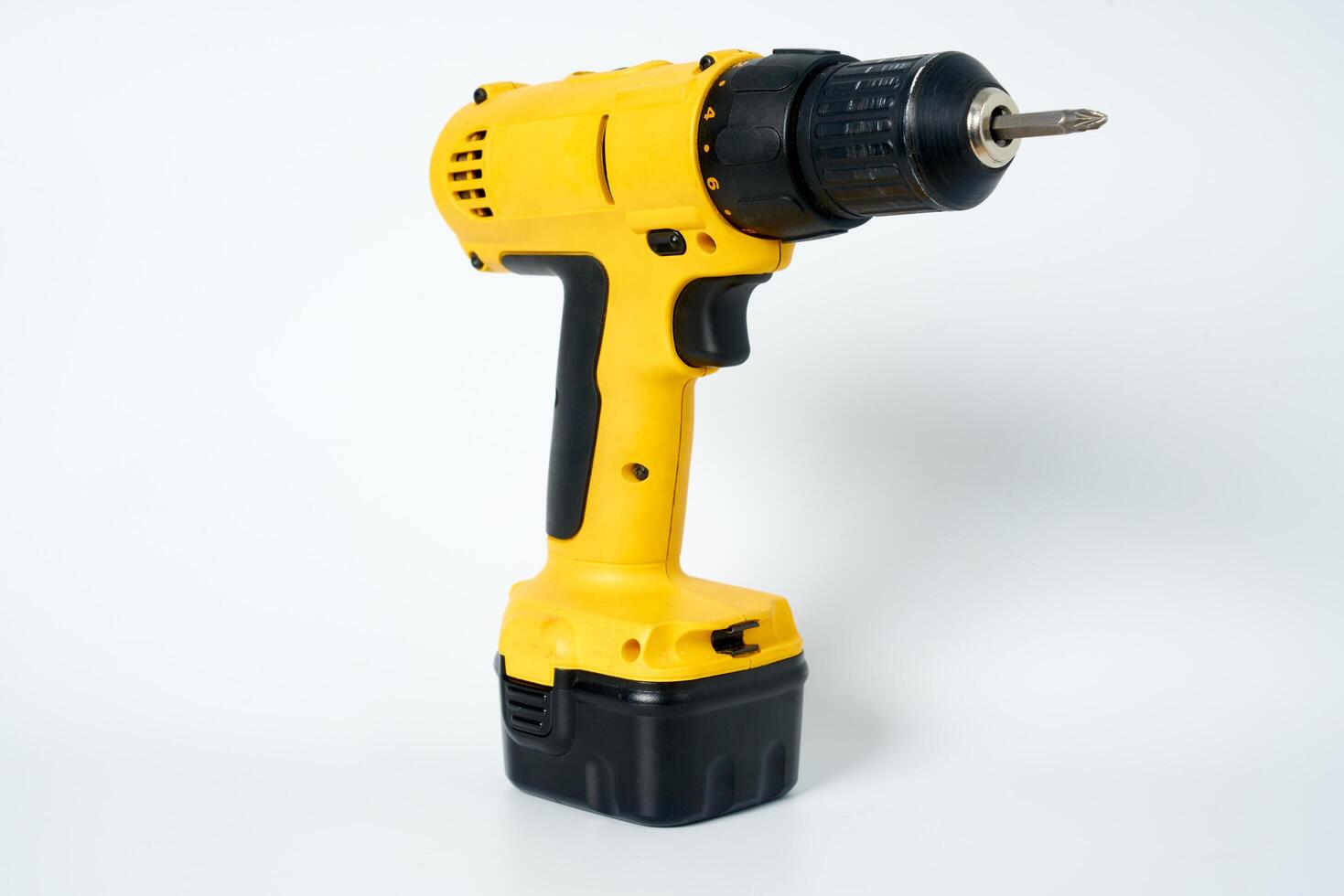 Yellow and black cordless drill. photo