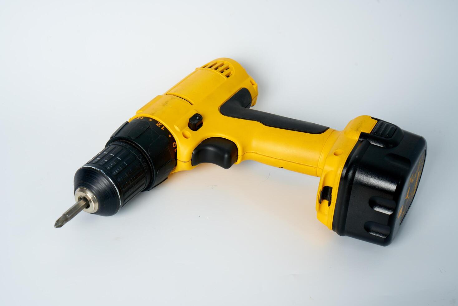 Yellow and black cordless drill. photo