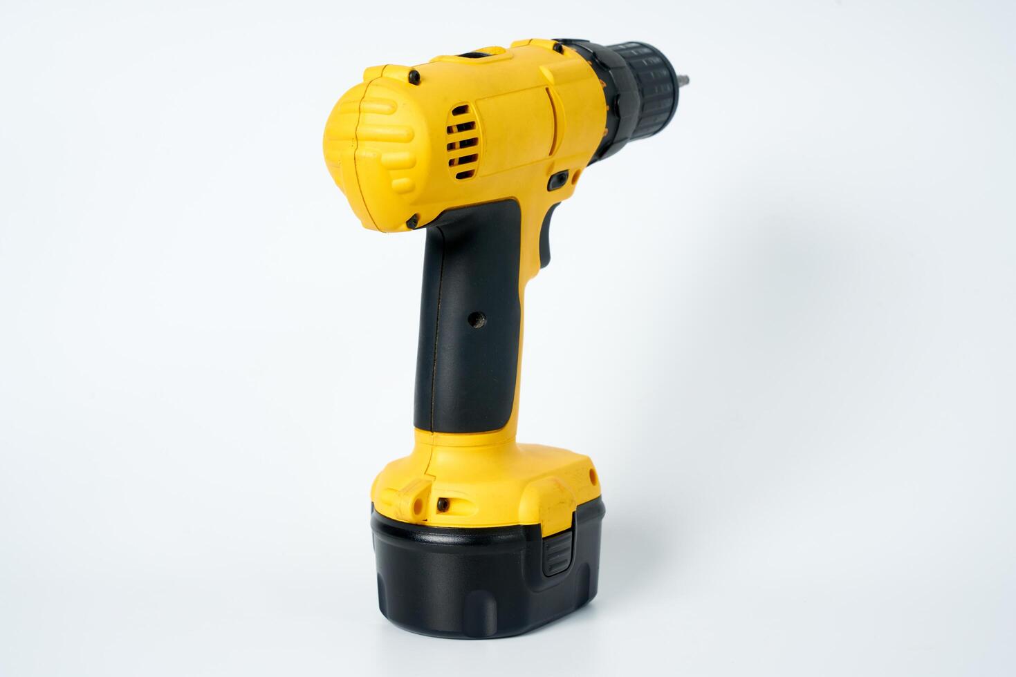 Yellow and black cordless drill. photo