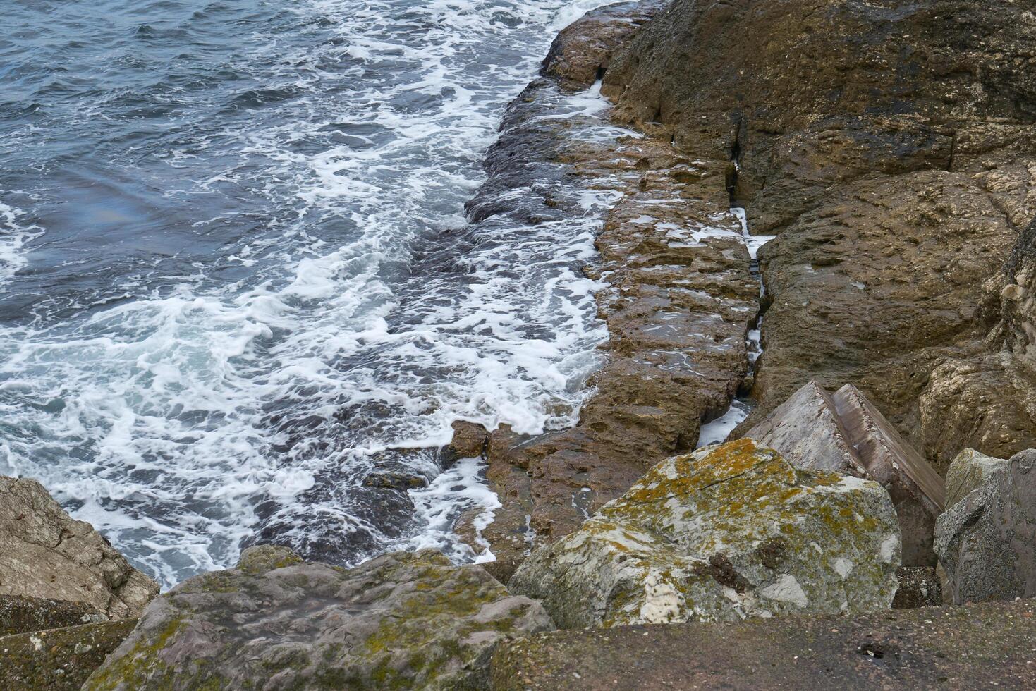 Rocky seashore in winter photo