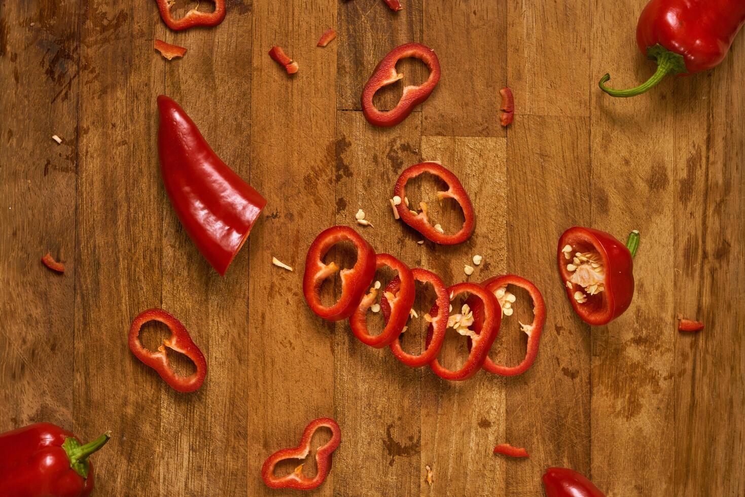 Slices of red pepper on a cutting board photo