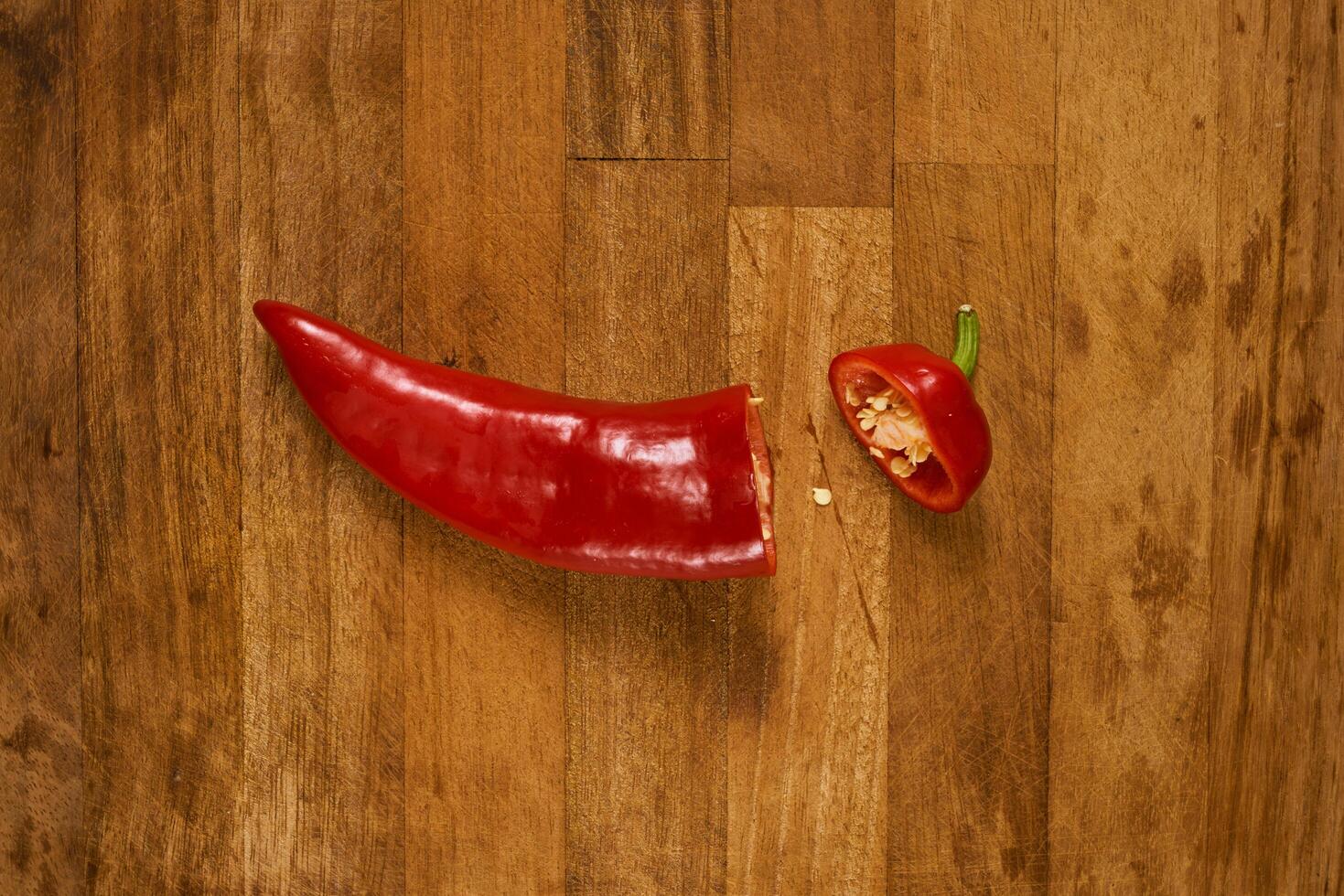 Slices of red pepper on a cutting board photo