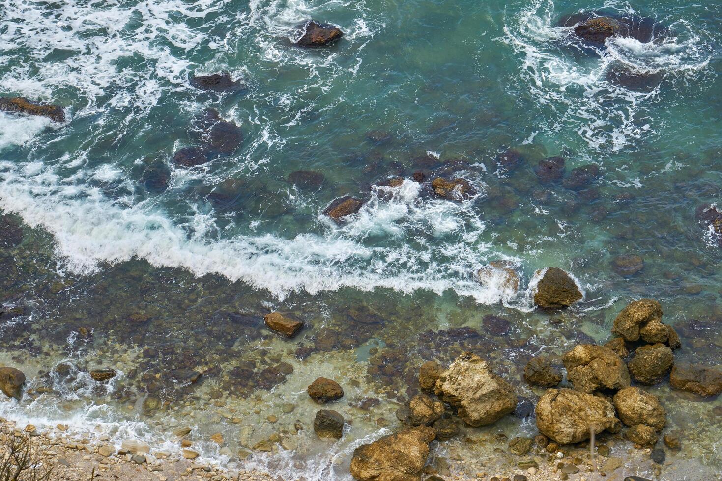 Rocky seashore in winter photo