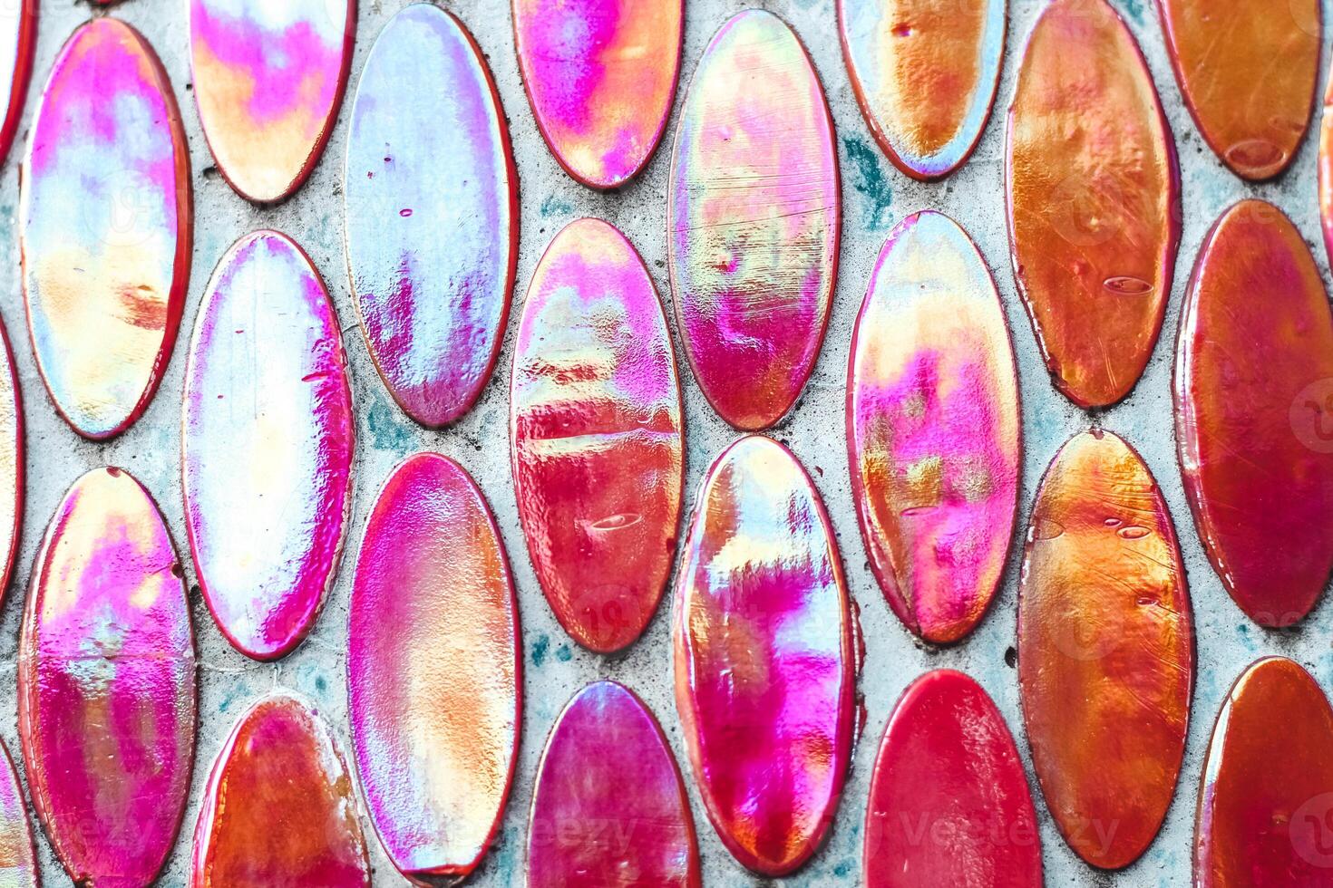Texture of mother-of-pearl mosaic round tiles, close-up photo
