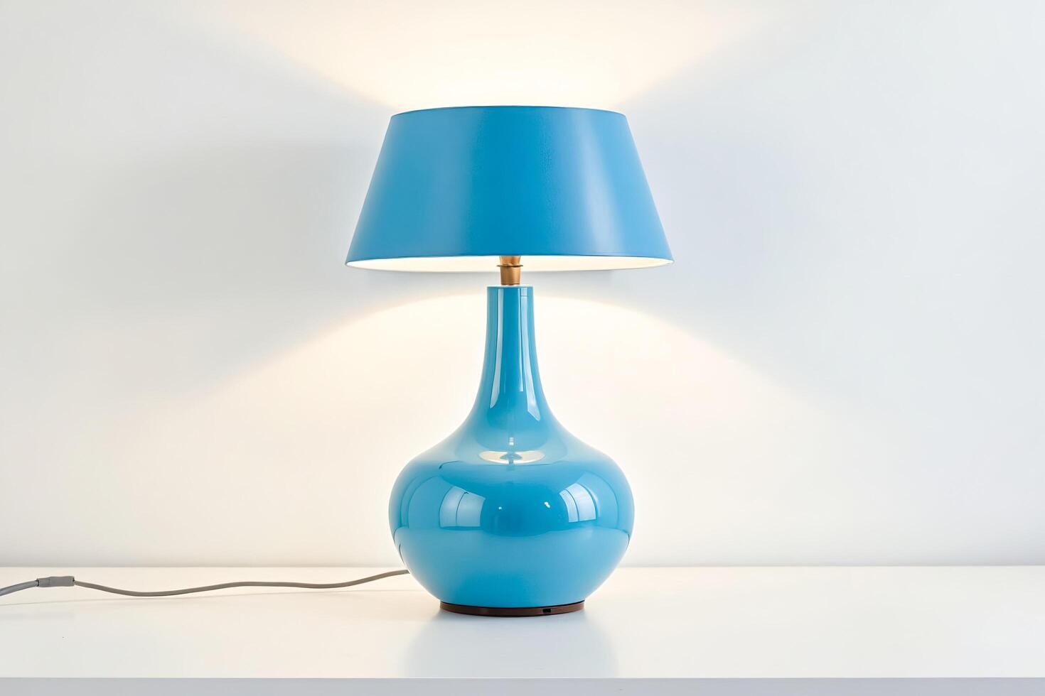 Blue Table Lamp with White Shade on a White Table photo