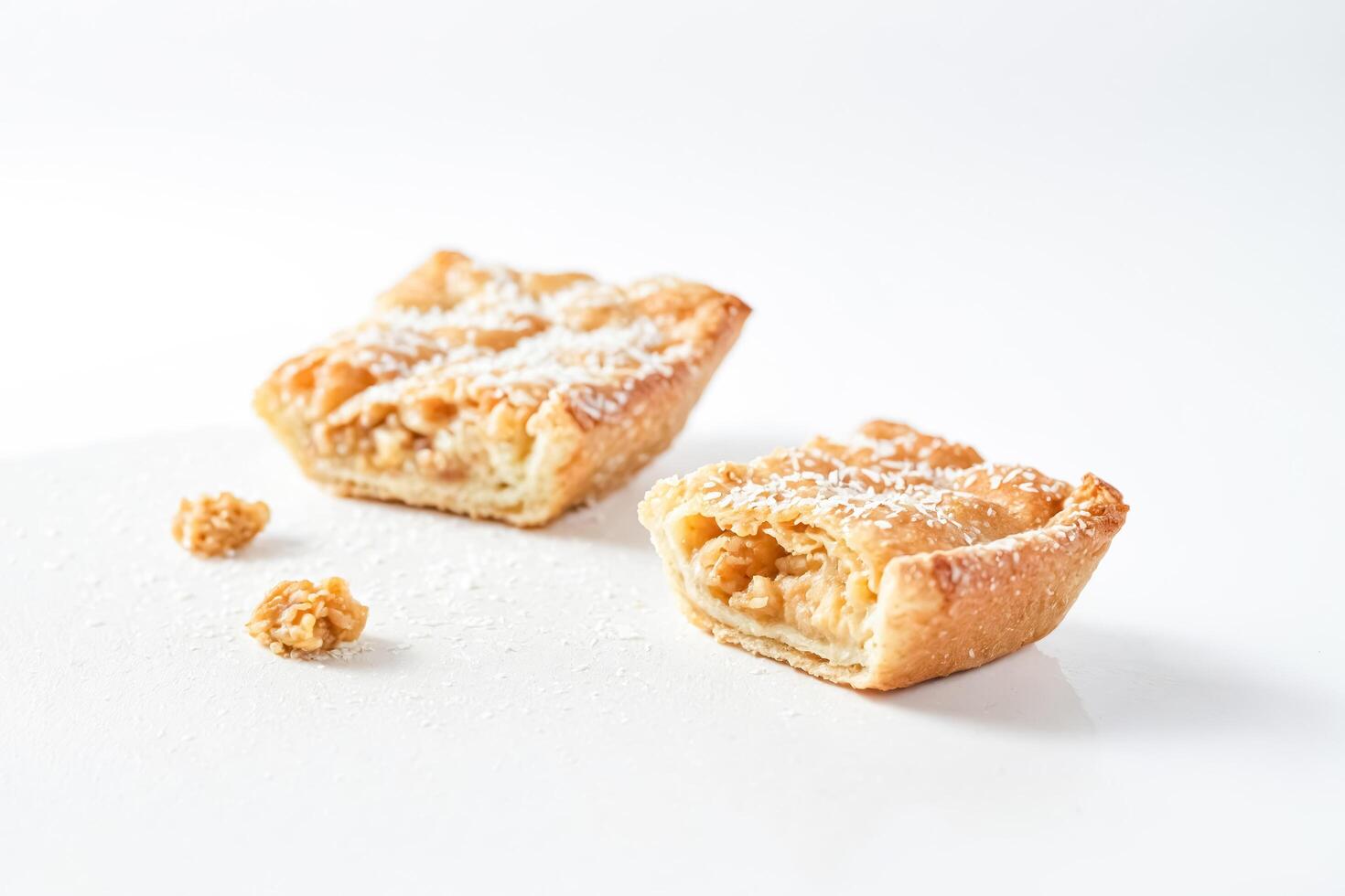 Coconut topped sweet pastry photo