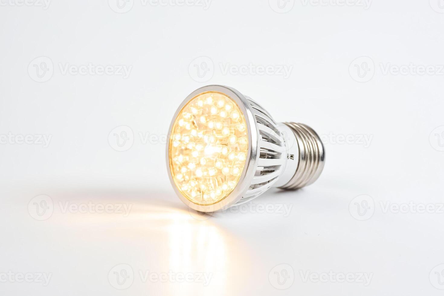 Close up of a modern LED light bulb on a white background photo