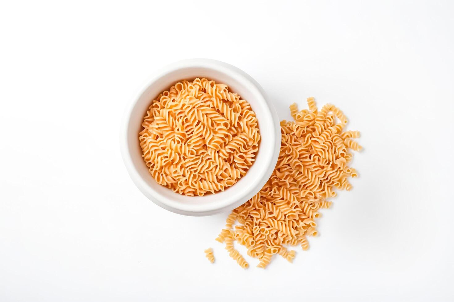 Dry Rotini Pasta in a White Bowl photo