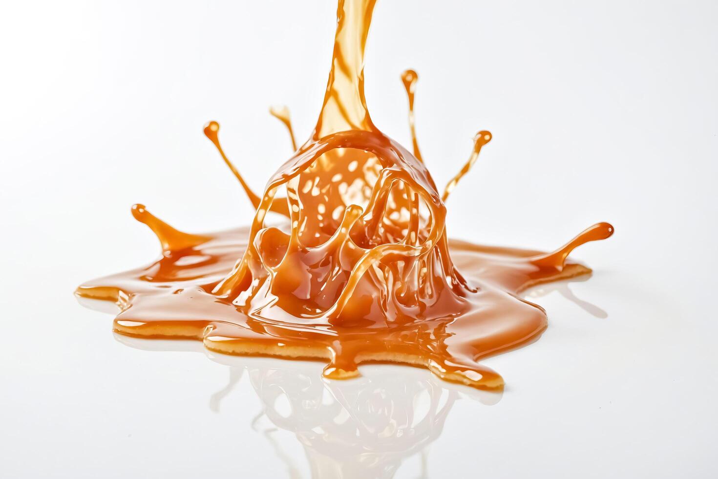 Caramel Splash on white background photo