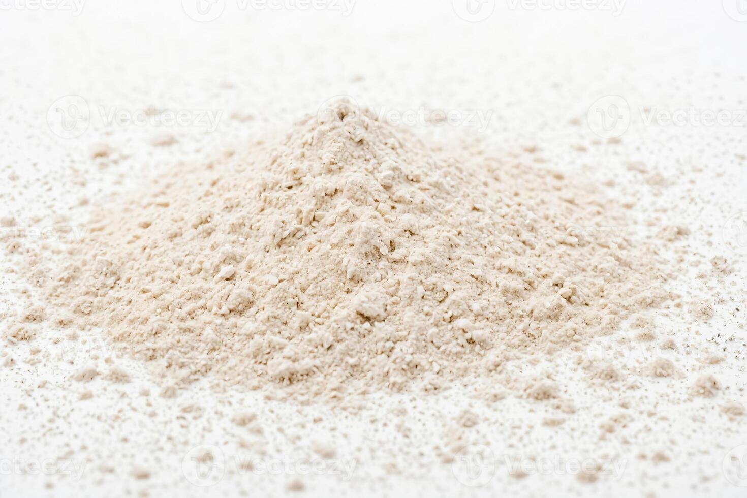 Close-up of white powder on white background photo
