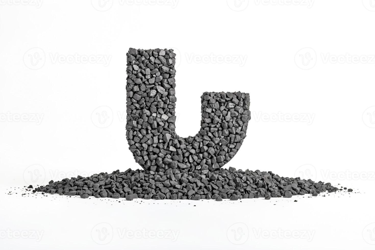 Letter J Formed by a Pile of Small Stones photo