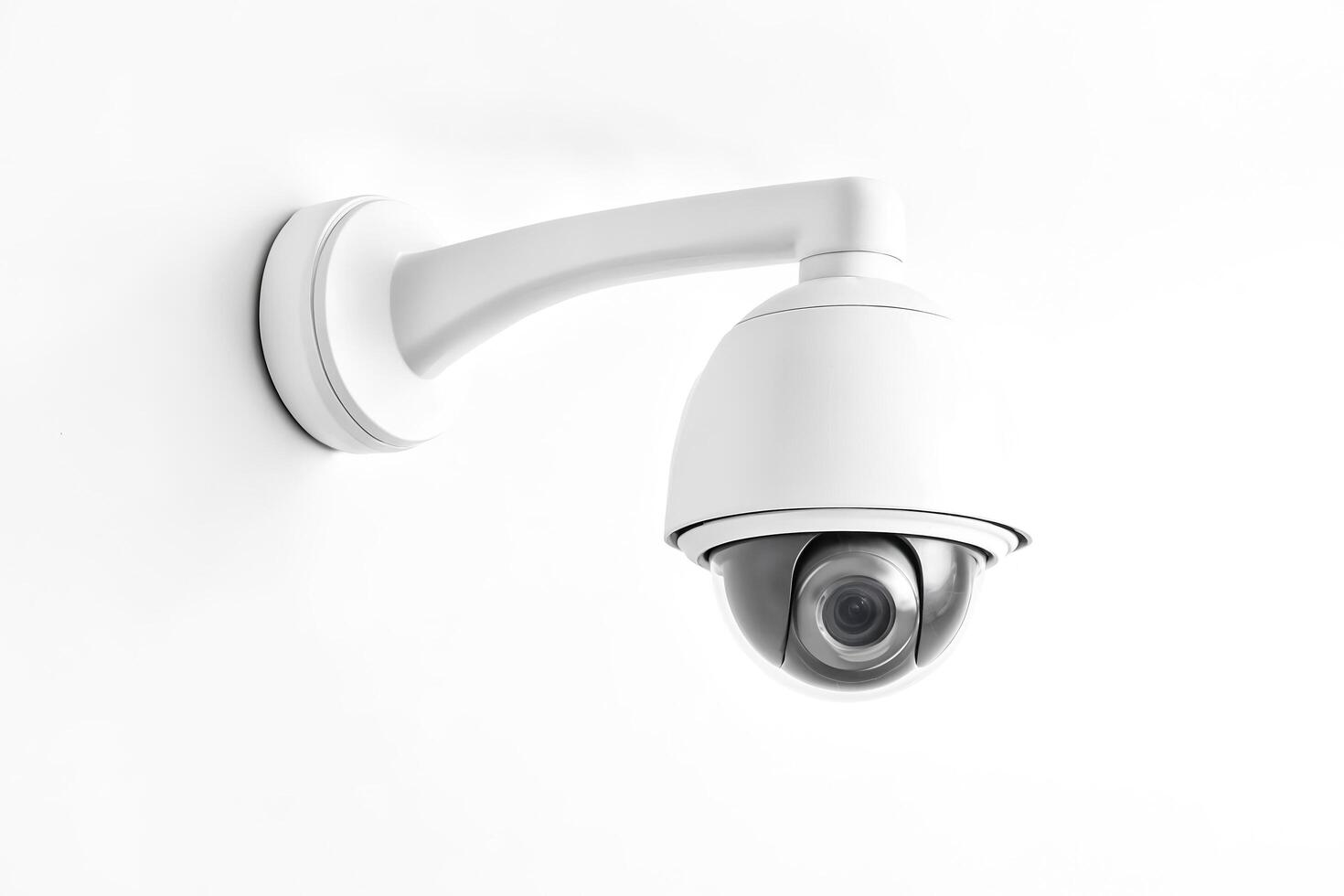 White Security Camera Mounted on a Wall photo