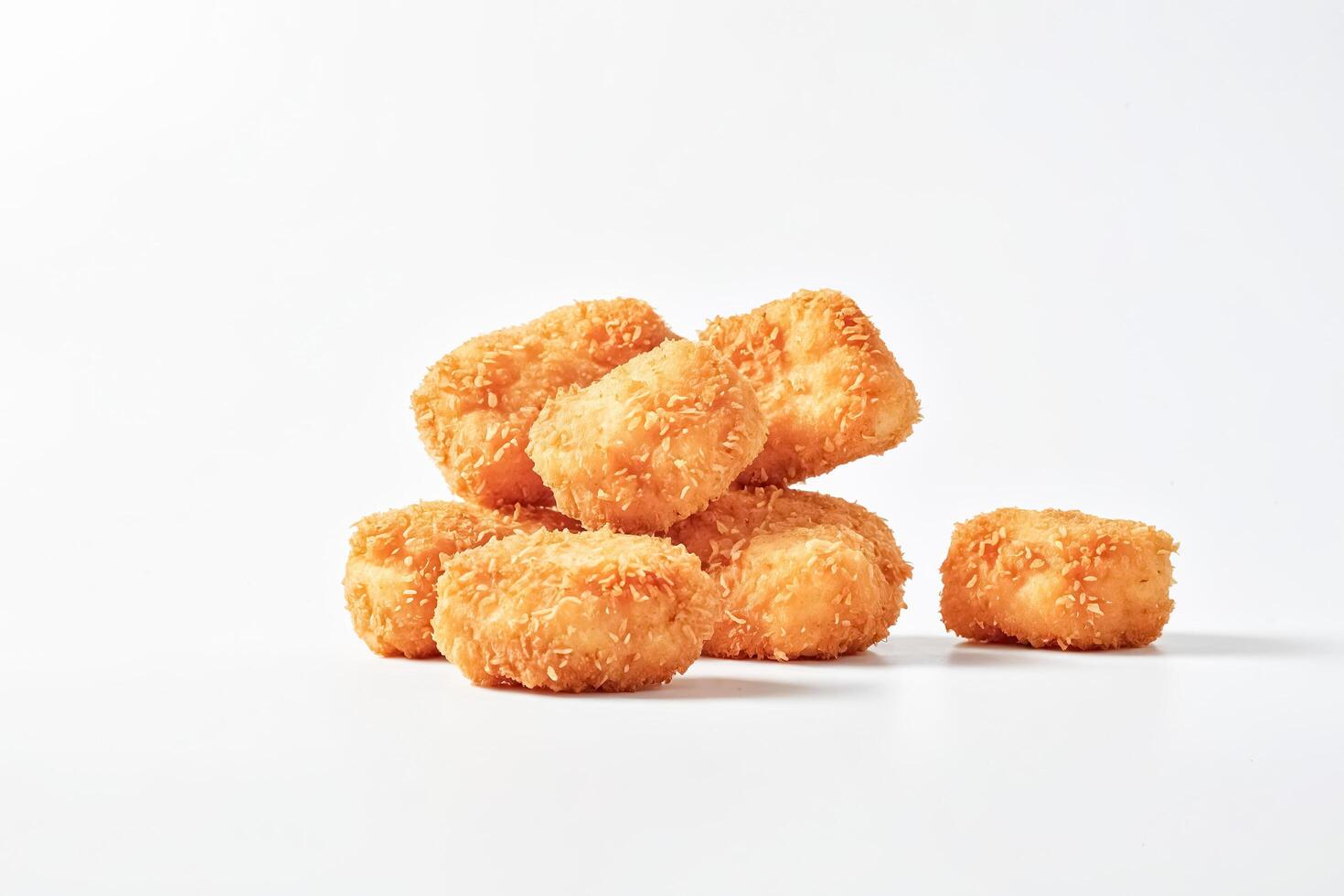 Crispy Coconut-Crusted Bites on White Background photo